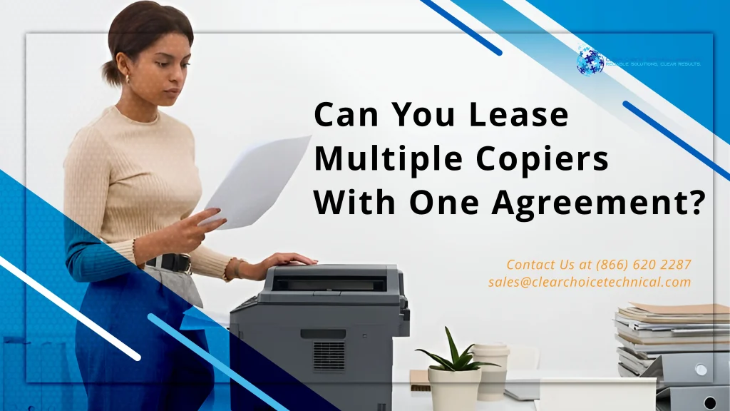 Birmingham office professional reviewing printed documents beside a leased multifunction copier under a fleet lease